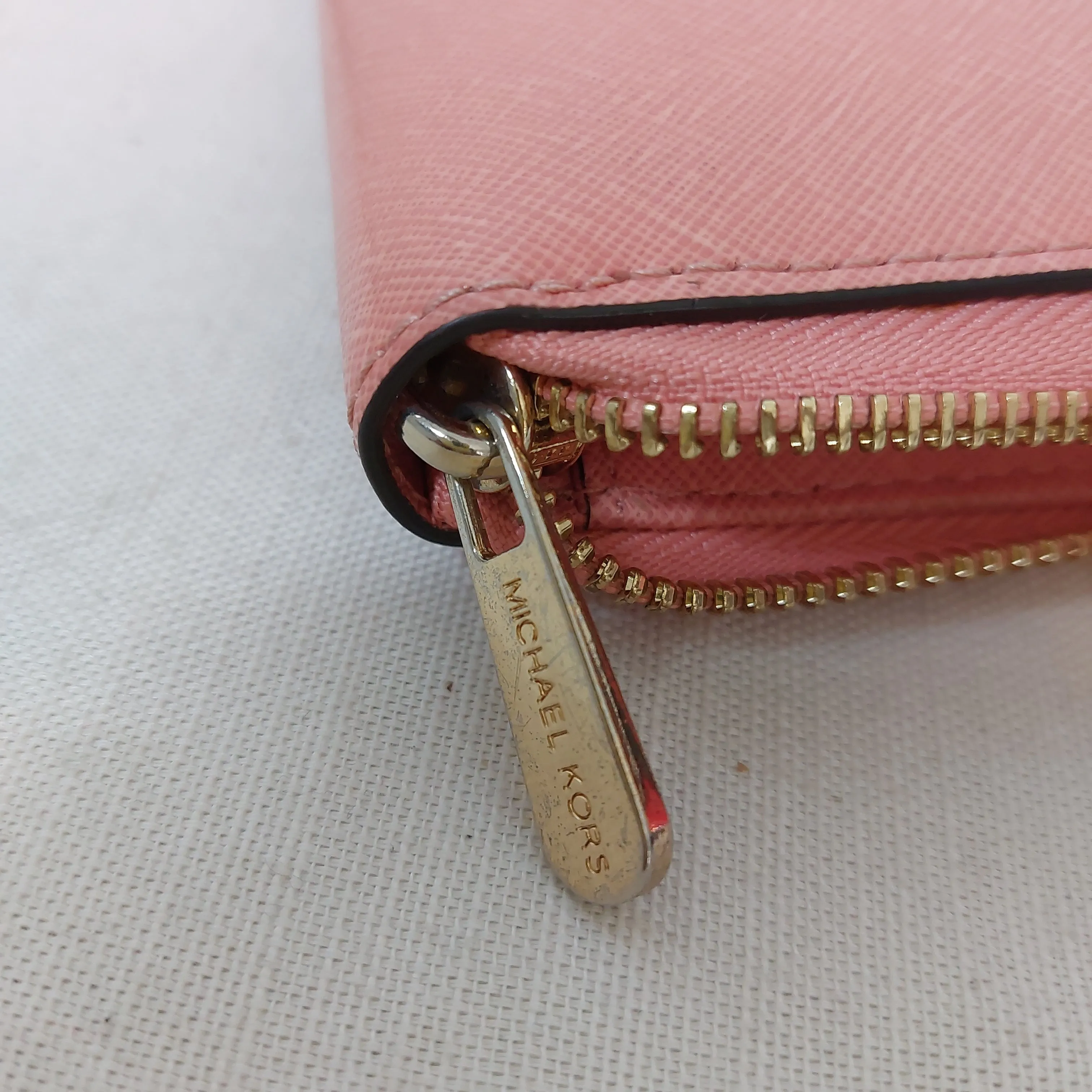 Michael Kors Salmon Pink Leather Zip-Around Wristlet | Gently Used |